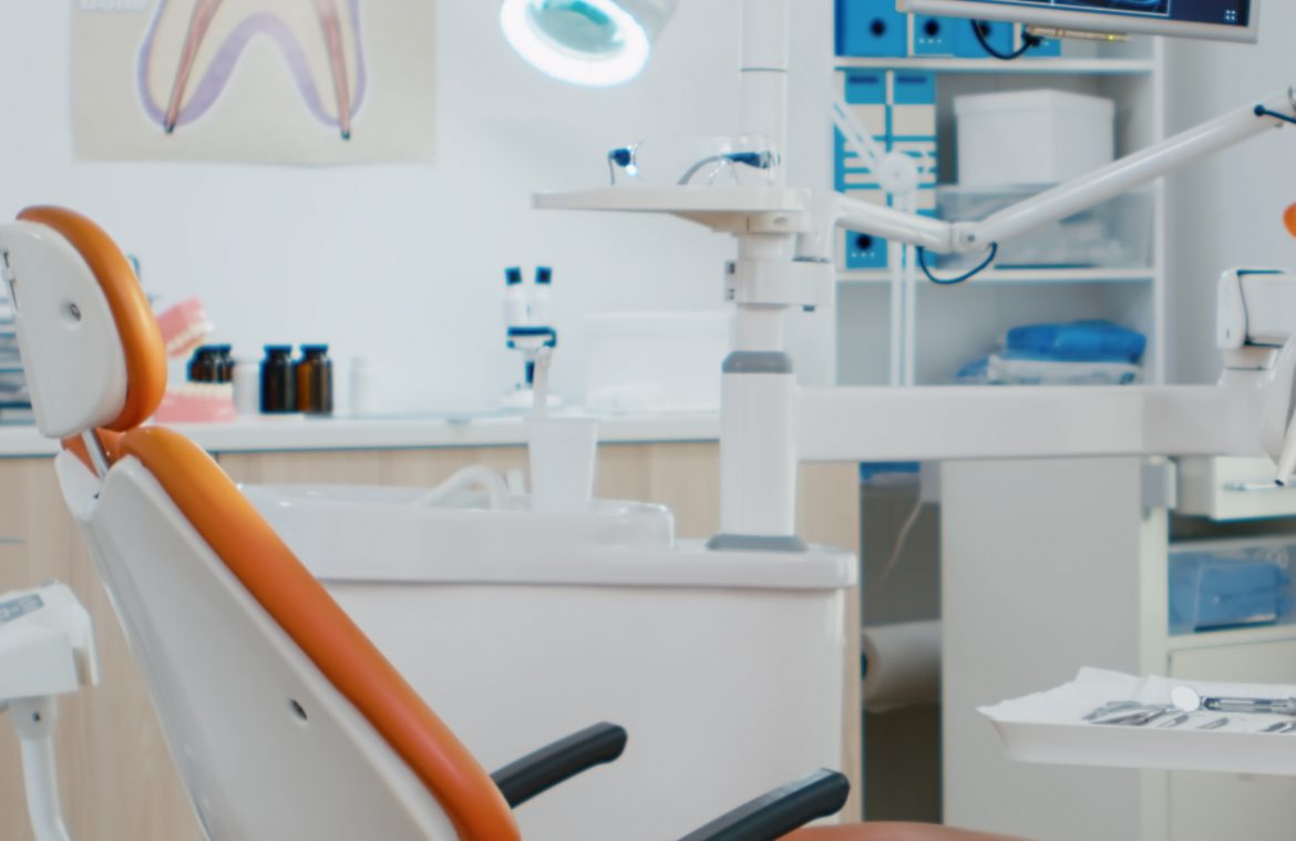 Interior of dentist stomatology orthodontic office with teeth radiography on monitor. Empty dental hospital room with nobody in it prepared for tooth diagnosis. Zoom in shot of medical workplace